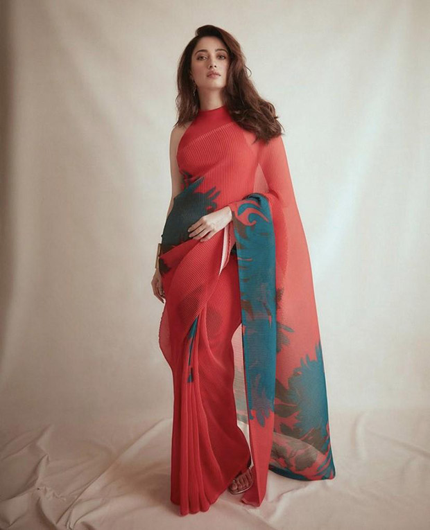 Tamannaah Bhatia amps up the drama with an 18k crimson pleated saree and halter neck blouse