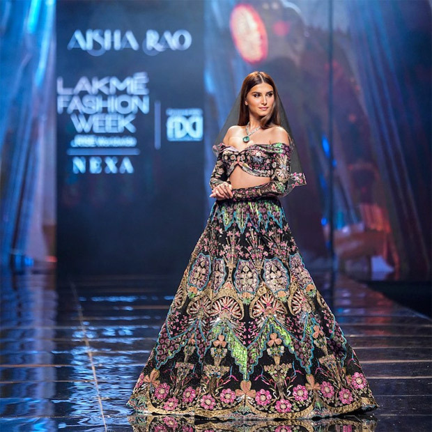 Tara Sutaria brings demure touch to Lakme Fashion Week in Aisha Rao’s festive embellished lehenga, off-shoulder choli and a veil