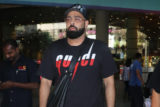 Badshah greets paps at the airport sporting a black outfit