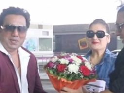 Govinda poses with his look alike at the airport with wife