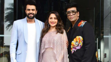 Karan Johar, Madhuri Dixit and Maniesh Paul smile for paps
