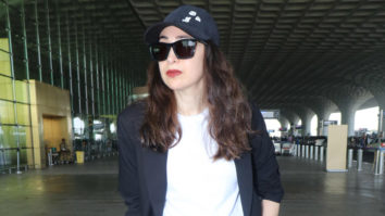 Karisma Kapoor poses for paps at the airport