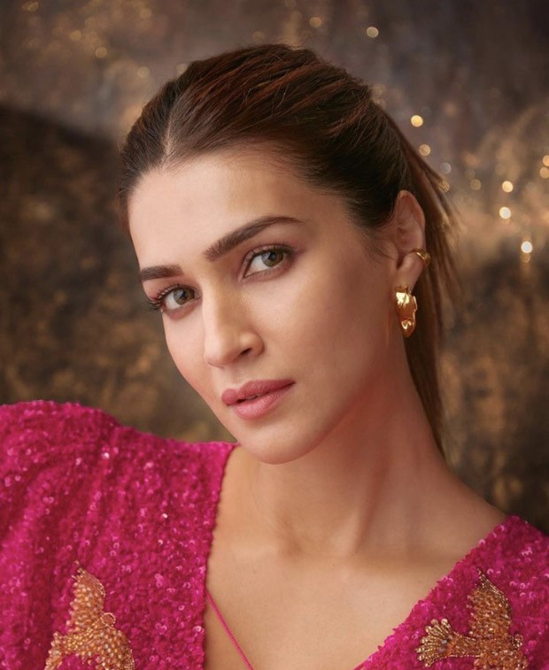 Kriti Sanon enchants fans in an embellished fuchsia mini dress by Zara Umrigar for Bhediya promotions