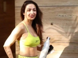 Malaika Arora smiles for paps in neon outfit outside gym
