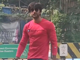 Meezaan Jafri poses with fans in red sweatshirt