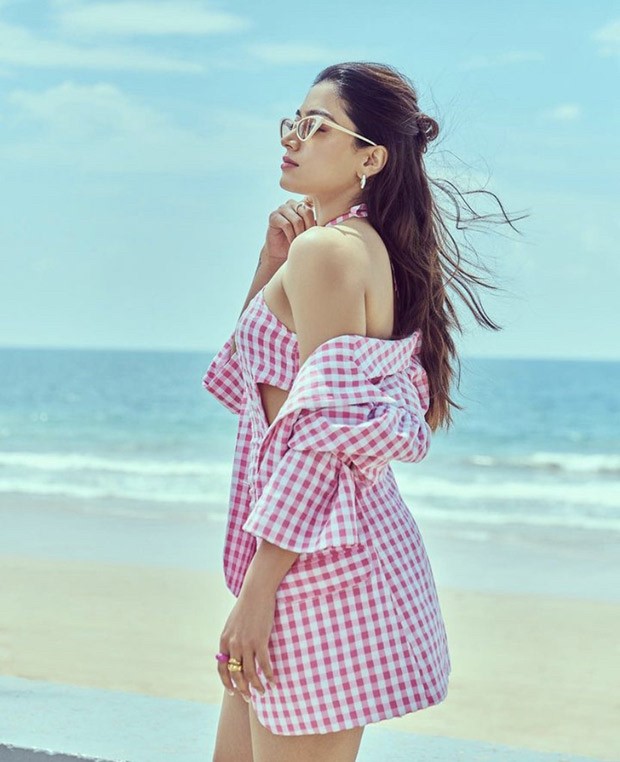 Rashmika Mandanna is a breath of fresh air as she poses at the beach wearing a sweet pink chequered cut-out dress