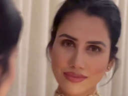 Sonnalli Seygall looks elegant in red showing off her beautiful smile