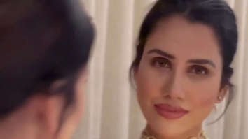 Sonnalli Seygall looks elegant in red showing off her beautiful smile