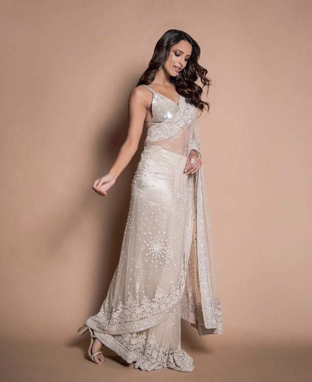 Tripti Dimri spells elegance in a gorgeous silver and ivory saree and strappy sequin blouse