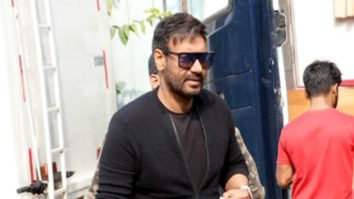 Ajay Devgn waves at paps in a black tshirt