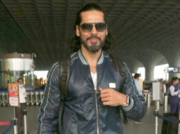 Dino Morea looks dapper in a leather jacket at the airport