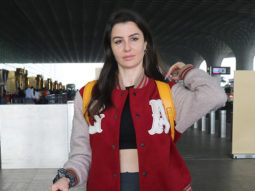 Giorgia Andriani poses for paps in a red jacket