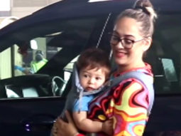 Hazel Keech poses with her cute little baby at the airport