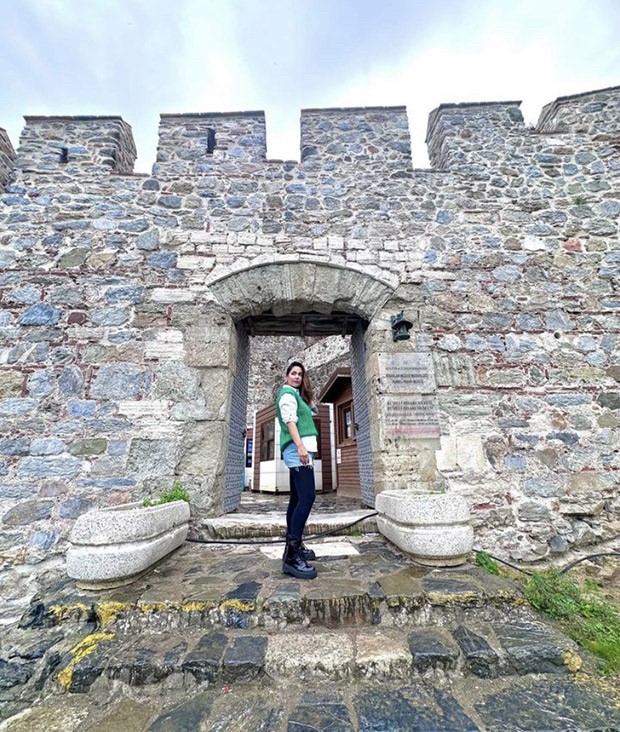 Hina Khan gives winter fashion cues in a bright green sweater vest and denim skirt while being on vacation in Turkey