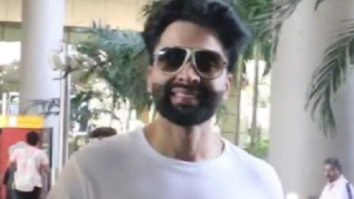 Jackky Bhagnani smiles for paps at the airport in plain white tshirt