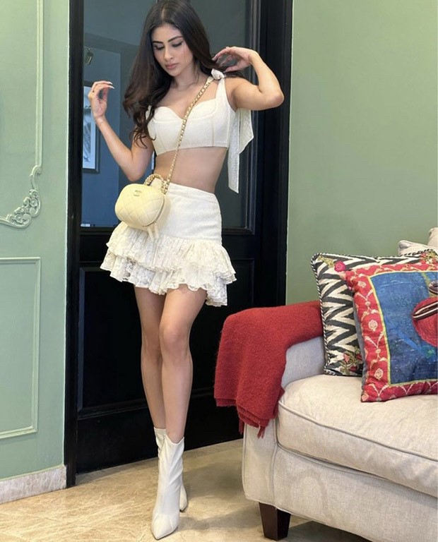 Mouni Roy offers up the hottest Christmas brunch ensemble in a cropped white bustier and a frilly white miniskirt