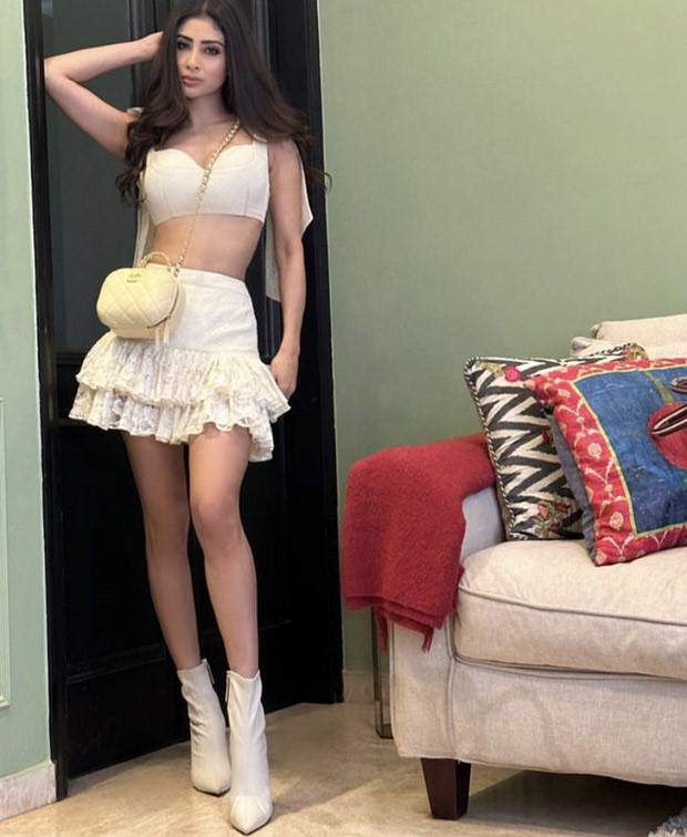 Mouni Roy offers up the hottest Christmas brunch ensemble in a cropped white bustier and a frilly white miniskirt