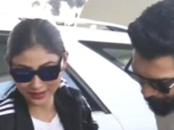 Mouni Roy smiles for paps as she gets clicked with husband at the airport