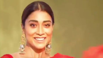 Shriya Saran looks smoking hot in a beautiful red saree