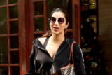 Sophie Choudry plays with a cute doggo as she poses with paps