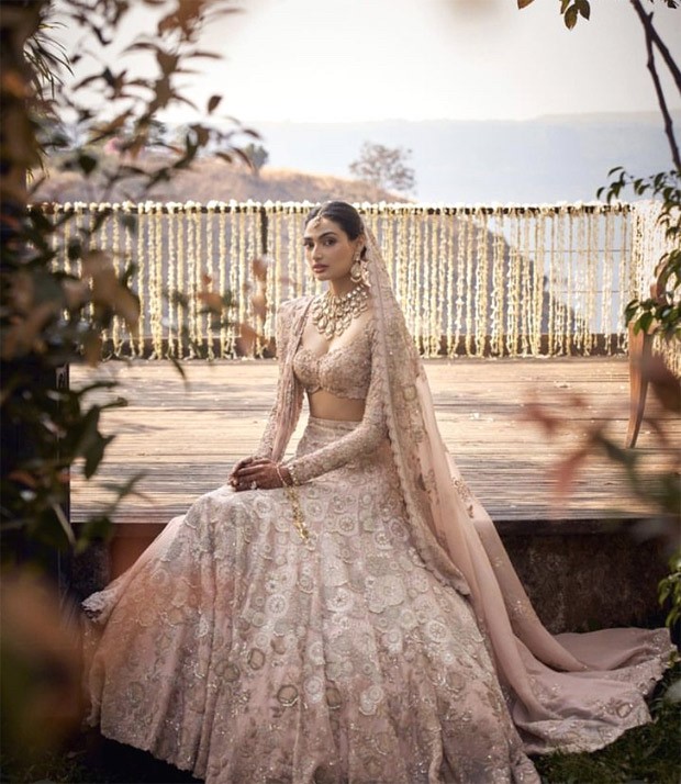 Athiya Shetty makes a vivacious bride in a blush pink lehenga by Anamika Khanna with radiant rose gold makeup