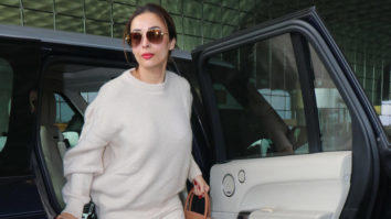 Malaika Arora slays an all white airport look as she gets clicked