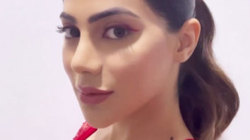 Nikki Tamboli looks gorgeous in a red saree