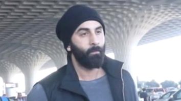 Ranbir Kapoor gets clicked at the airport sporting a black beanie as he poses with fans