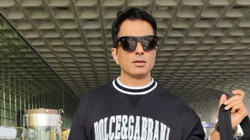 Sonu Sood chit chats with pap as he poses in an all black outfit at the airport
