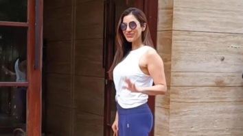 Sophie Choudry smiles for paps as she plays with a cute dog