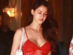 Disha Patani looks crackling dressed in a sexy red top with denims