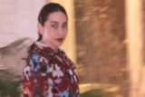 Karisma Kapoor cheerfully waves at paps dressed in a flowy outfit