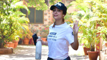 Malaika Arora pets her dog before leaving for her daily gym session