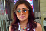 Tina Dutta pairs up her all white look with funky glasses as she poses for paps