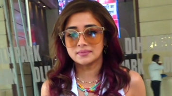 Tina Dutta pairs up her all white look with funky glasses as she poses for paps