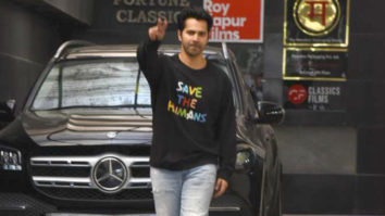 Varun Dhawan smiles as he poses for paps