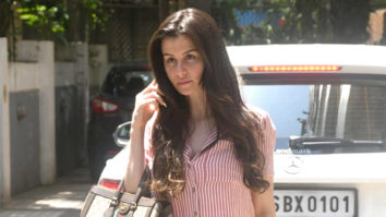 Giorgia Andriani poses for paps in a striped outfit