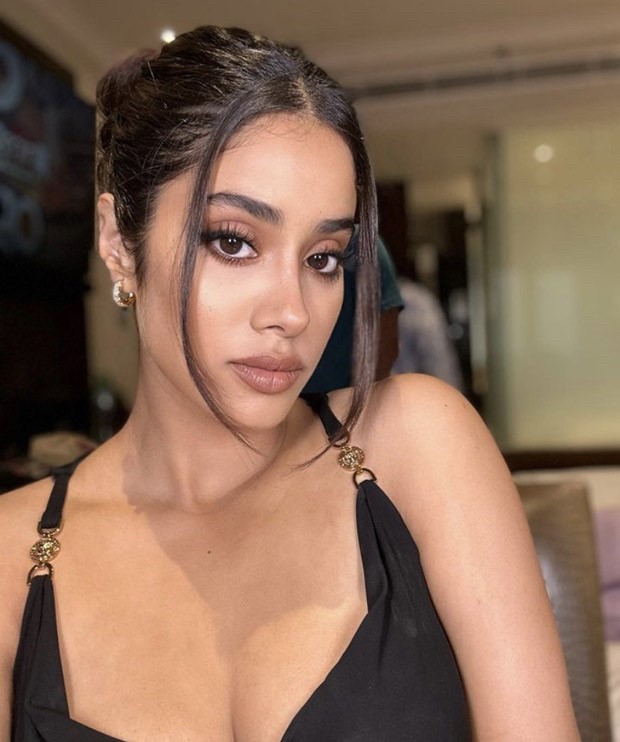 Janhvi Kapoor is giving off some serious looks while wearing a black midi dress from Versace that cost Rs.2.44 Lakh