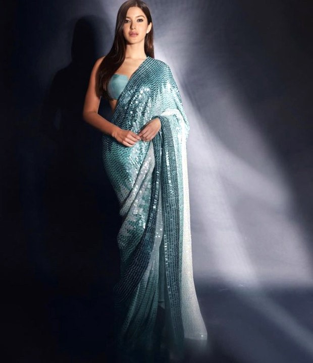 Shanaya Kapoor accentuates her statuesque form in a blue shimmery sari by Manish Malhotra worth Rs.2.25 Lakh