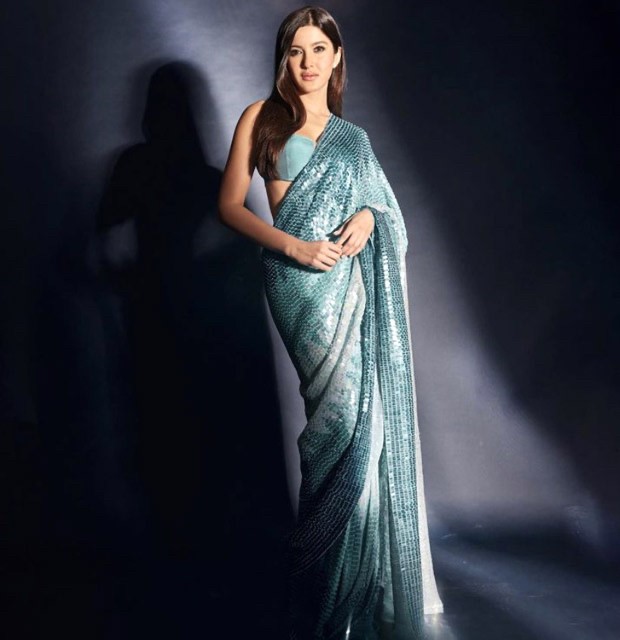 Shanaya Kapoor accentuates her statuesque form in a blue shimmery sari by Manish Malhotra worth Rs.2.25 Lakh