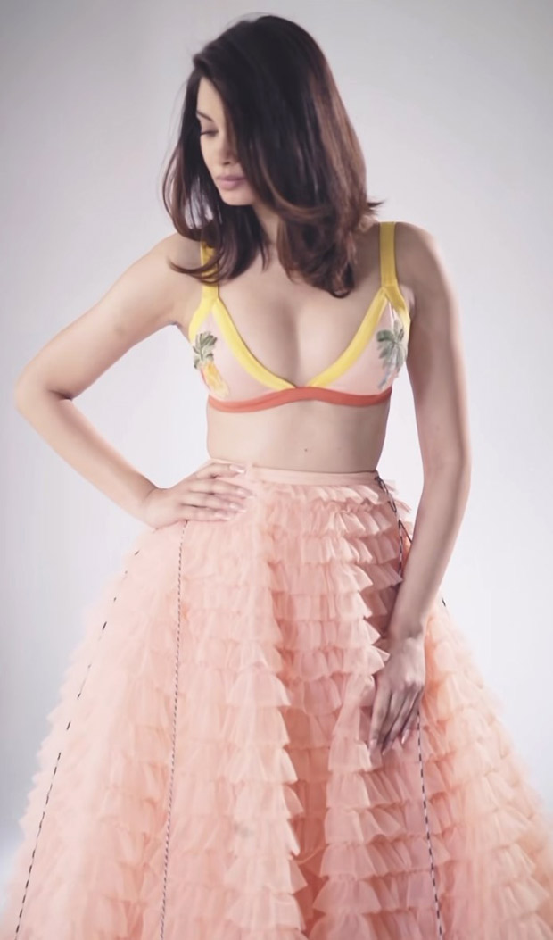 Diana Penty twirls in a charming tulle skirt and a bikini with a tropical palm print
