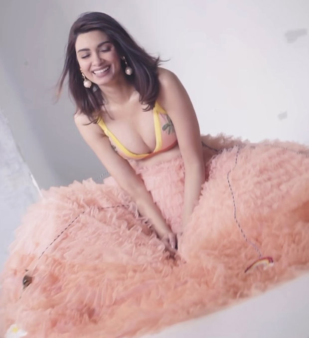 Diana Penty twirls in a charming tulle skirt and a bikini with a tropical palm print