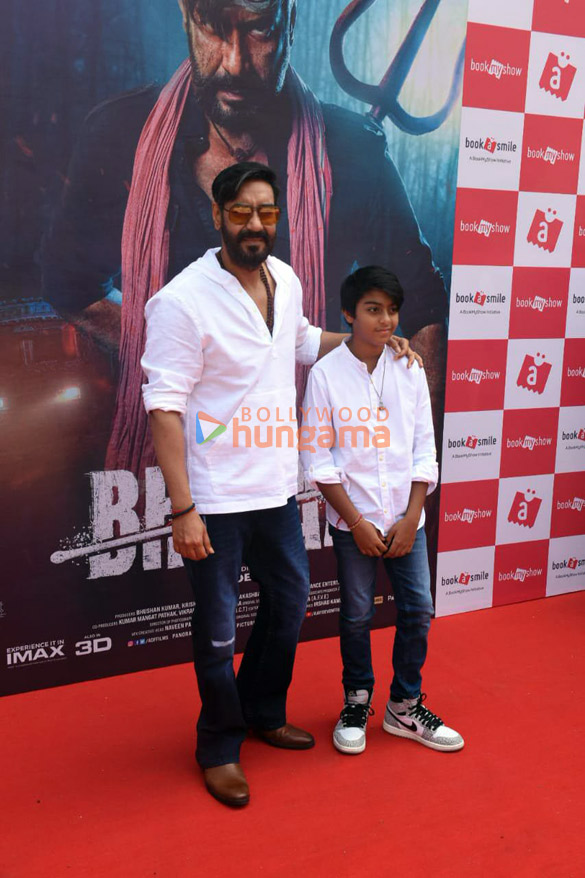 photos ajay devgn and snapped with his son at a screening of bholaa 1