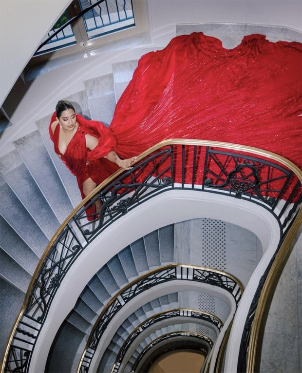 Cannes 2023: Raja Kumari makes the most of her sparkling appearance in a red sequin saree gown by Manish Malhotra