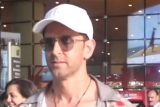 Hrithik Roshan poses with fans as he returns from IIFA