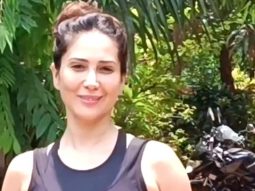 Kim Sharma waves at paps as she gets clicked outside her gym