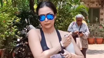 Malaika Arora poses with a little fan post gym session