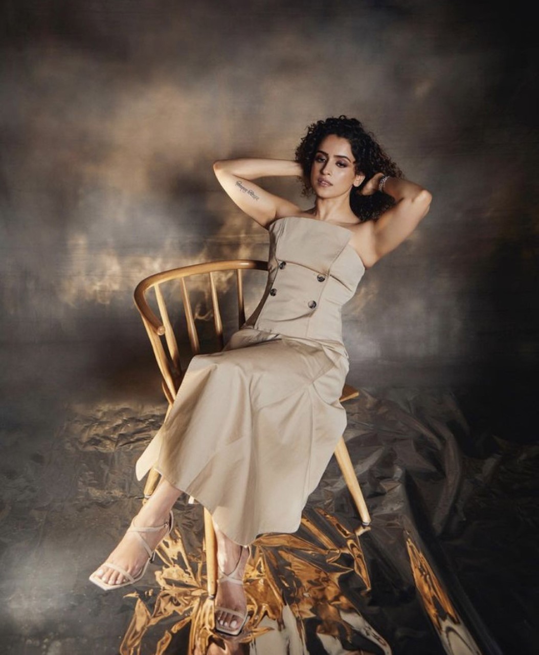 Sanya Malhotra exudes effortless elegance in a beige strapless dress with delicate button detailing