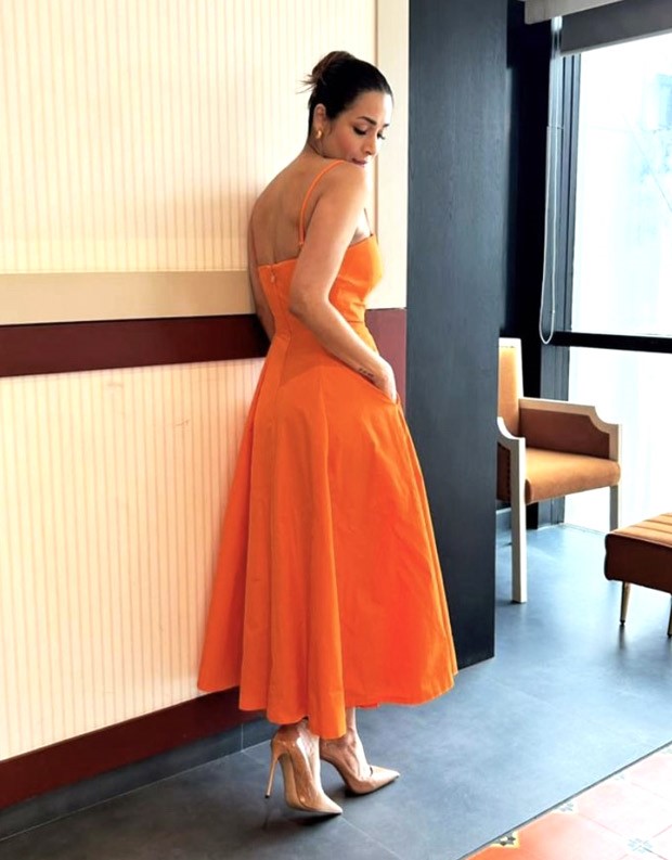 Malaika Arora's vibrant orange dress from the Kate Spade racks is the epitome of summer style