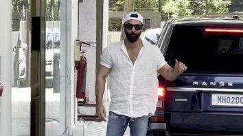 Ranbir Kapoor poses for paps in a white shirt and denims